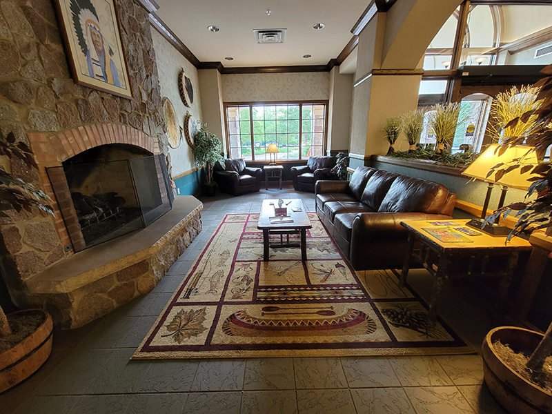Lounge with fireplace at the Potawatomi Inn